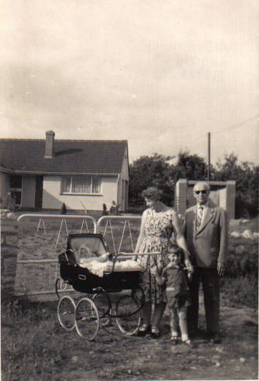 Helga in pram and little Phil and father with me, in 1960 when my parents visited me in UK.