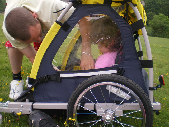 A little carre, which is fixed to Stef's bike, when he and Lynda take the children on short bike rides along food paths. They are strapped in and really enjoy their trips.