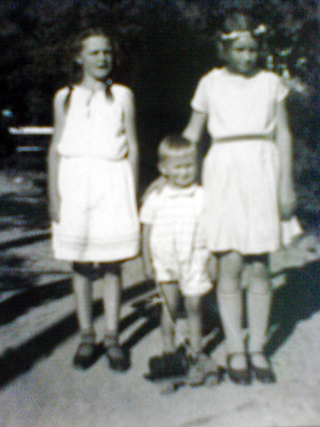 Childhood photo of Helga, Dieter and myself in Helga's garden.